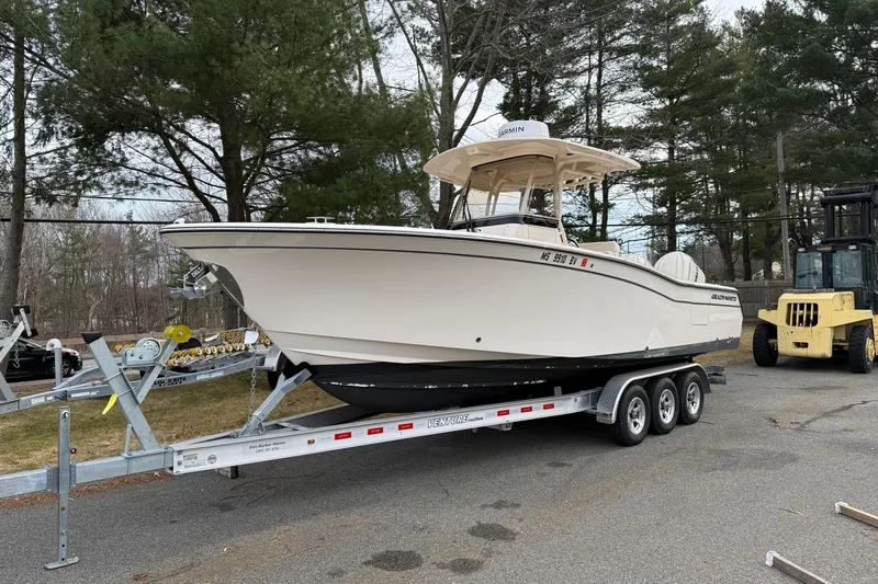 The Image of 2024 Grady-White Canyon 271 boat on trailer, parked outdoors. - 0