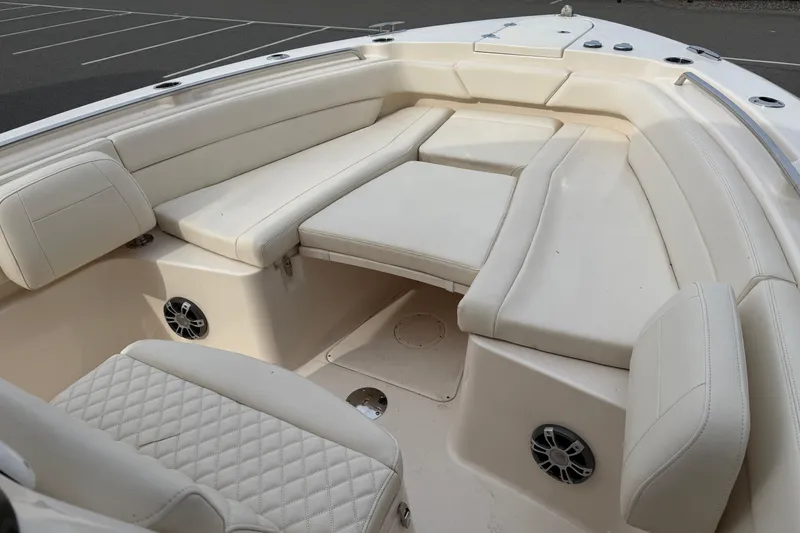 Slide: The Image of 2024 Grady-White Canyon 271 boat interior with luxurious seating and modern design. - 10