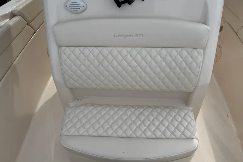 Slide: The Image of 2024 Grady-White Canyon 271 boat seat with diamond-stitched upholstery. - 11