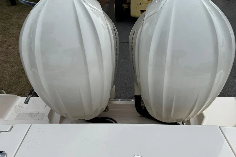 Slide: The Image of Twin outboard engines on a 2024 Grady-White Canyon 271 boat. - 20