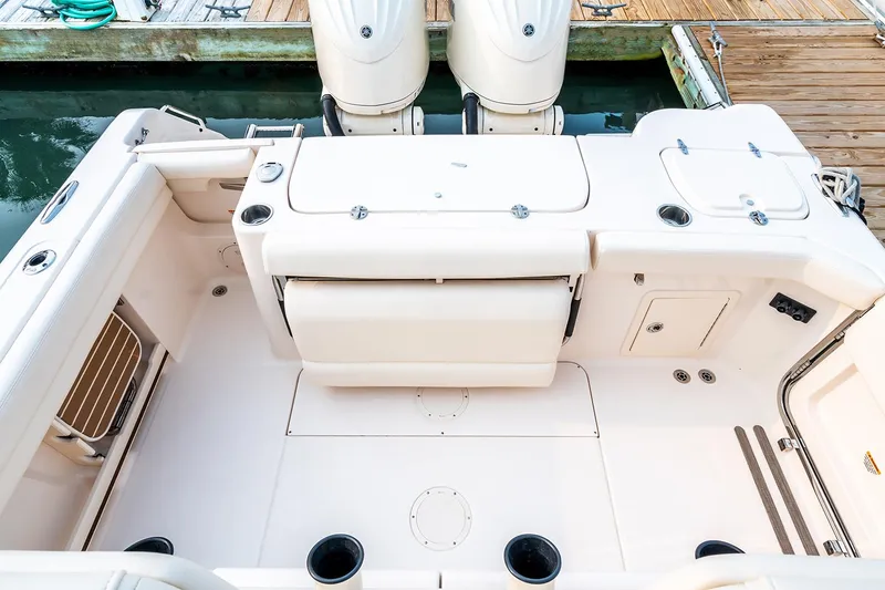 Slide: The Image of Manufacturer Provided Image: 2024 Grady-White Canyon 271 boat deck with twin outboard engines. - 21