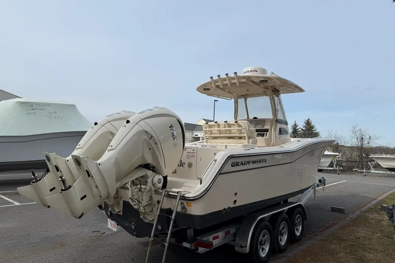 Slide: The Image of 2024 Grady-White Canyon 271 boat with dual engines on a trailer. - 4