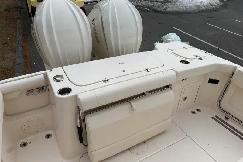 Slide: The Image of 2024 Grady-White Canyon 271 boat deck with dual Yamaha outboard engines. - 7