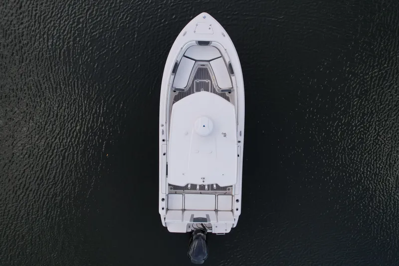 Slide: The Image of Aerial view of 2021 Robalo R230 Center Console boat on dark water. - 14