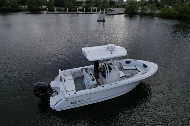 Slide: The Image of 2021 Robalo R230 Center Console boat on calm water, aerial view. - 15