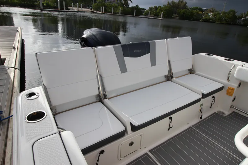 Slide: The Image of 2021 Robalo R230 Center Console boat with comfortable seating and sleek design. - 27