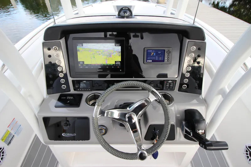 Slide: The Image of 2021 Robalo R230 Center Console dashboard with navigation and control systems. - 34