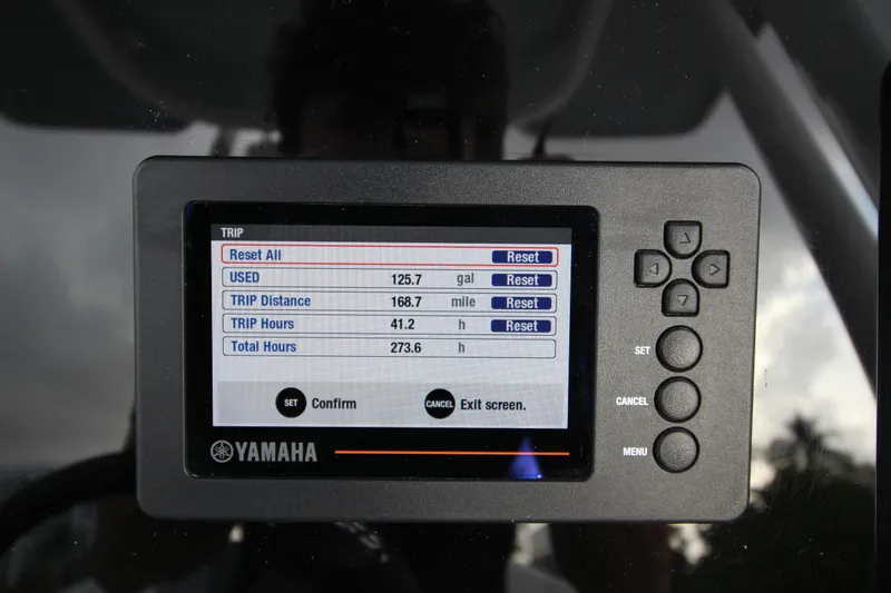 Slide: The Image of Yamaha display on 2021 Robalo R230 Center Console showing trip data and settings. - 35