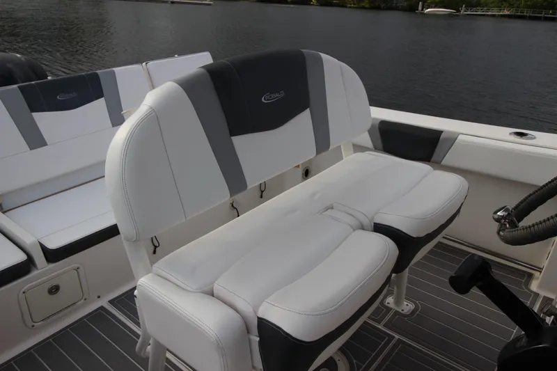 Slide: The Image of 2021 Robalo R230 Center Console boat seating with sleek white and gray design. - 37