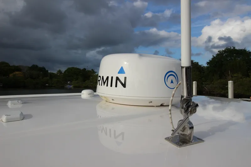 Slide: The Image of Garmin radar on 2021 Robalo R230 Center Console boat under cloudy sky. - 48