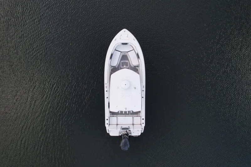 Slide: The Image of Aerial view of 2021 Robalo R230 Center Console boat on dark water. - 5