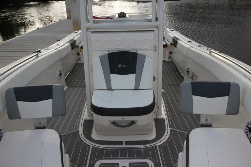Slide: The Image of 2021 Robalo R230 Center Console boat interior with seating and deck view. - 52