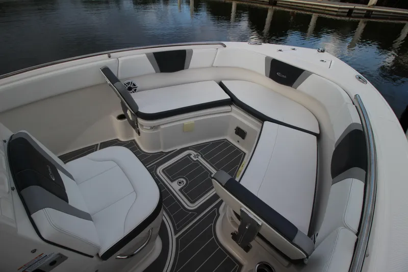 Slide: The Image of 2021 Robalo R230 Center Console boat interior with cushioned seating and sleek design. - 57