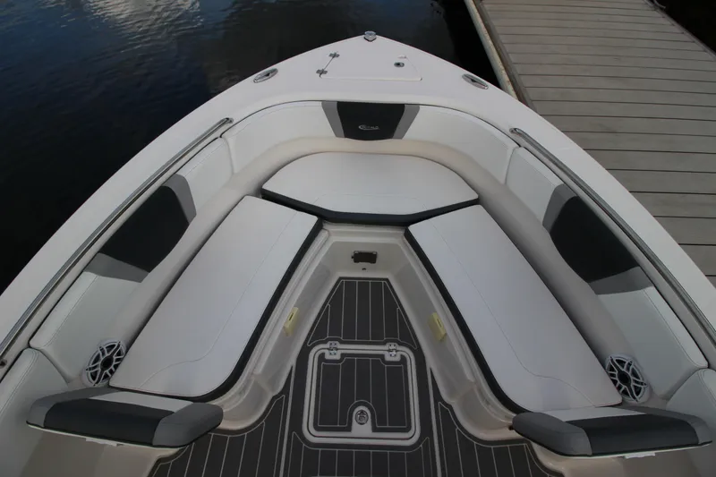 Slide: The Image of 2021 Robalo R230 Center Console boat interior with cushioned seating and deck view. - 58