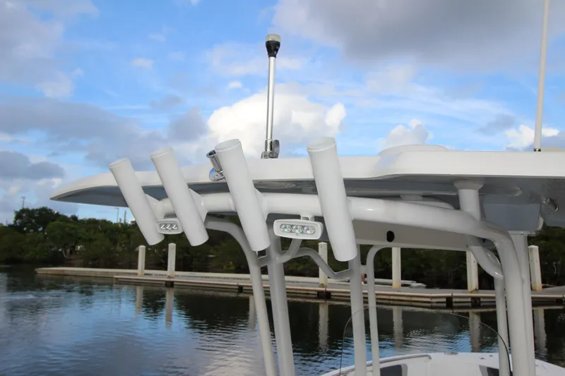 Slide: The Image of 2021 Robalo R230 Center Console boat with rod holders and LED lights. - 61