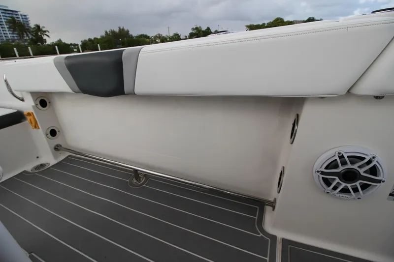 Slide: The Image of 2021 Robalo R230 Center Console boat interior with cushioned seating and marine speaker. - 66