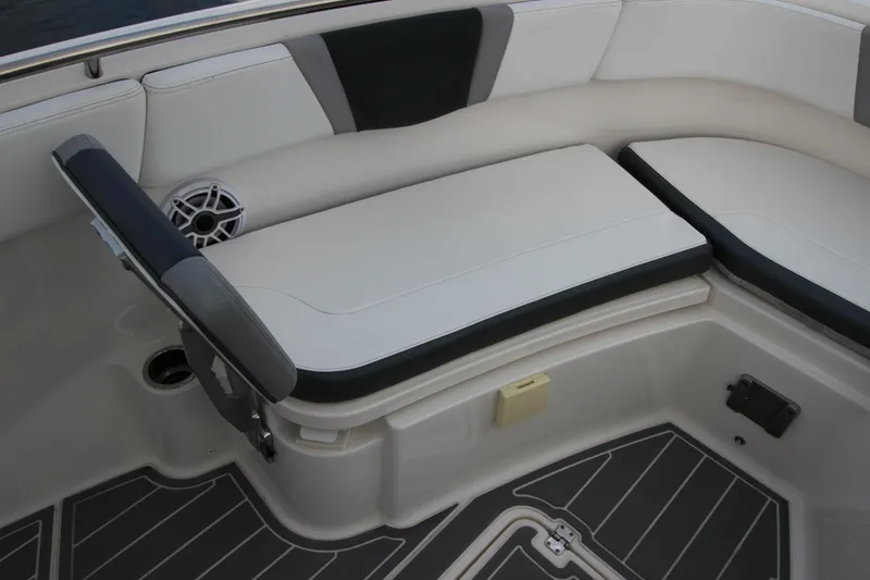 Slide: The Image of 2021 Robalo R230 Center Console boat seating area with cushioned seats and speaker. - 68