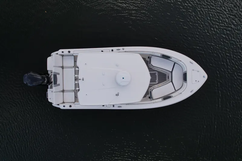 Slide: The Image of Overhead view of 2021 Robalo R230 Center Console boat on water. - 7