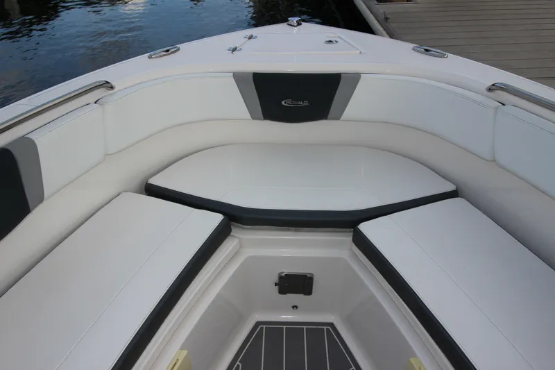 Slide: The Image of 2021 Robalo R230 Center Console boat interior with cushioned seating and storage. - 70