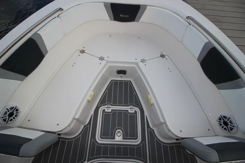 Slide: The Image of 2021 Robalo R230 Center Console boat interior with cushioned seating and storage compartments. - 71