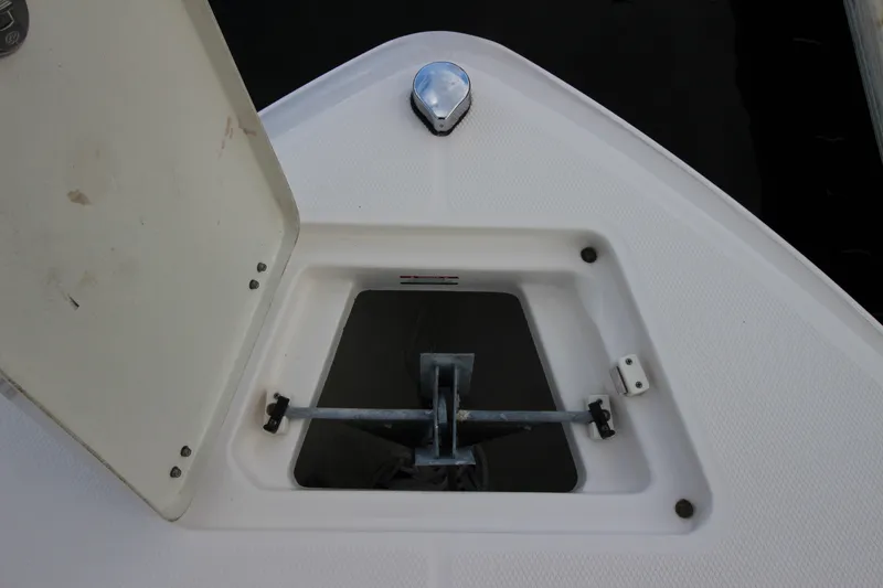 Slide: The Image of Anchor storage compartment on a 2021 Robalo R230 Center Console boat. - 73