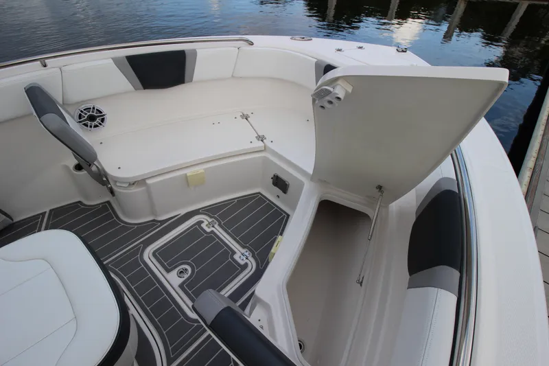 Slide: The Image of 2021 Robalo R230 Center Console boat interior with open storage compartment and seating. - 74