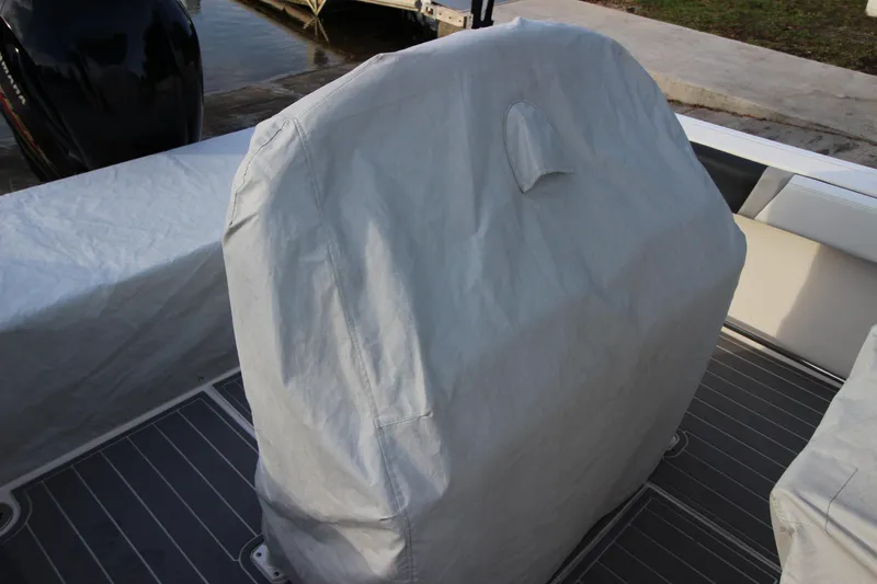 Slide: The Image of Covered seating on a 2021 Robalo R230 Center Console boat deck. - 84