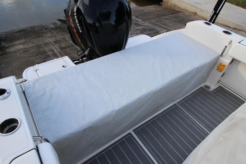 Slide: The Image of 2021 Robalo R230 Center Console boat with Yamaha engine, covered seating area. - 85