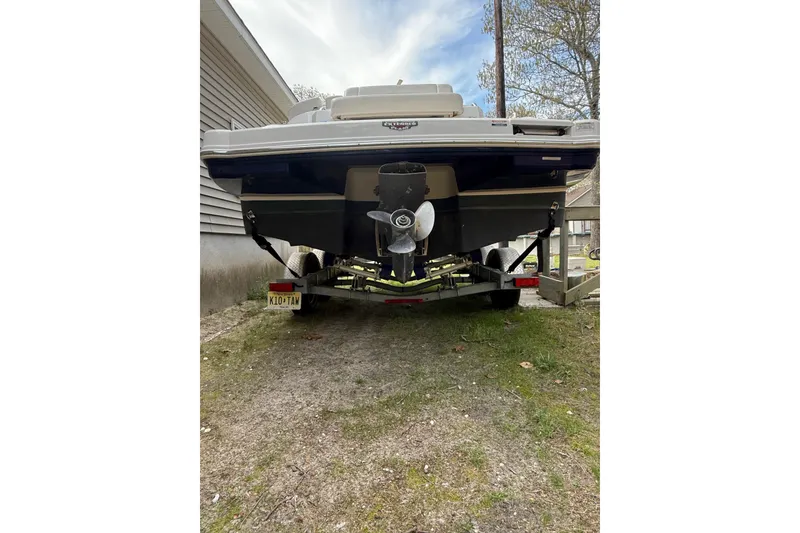 Slide: The Image of Rear view of a 2016 Chaparral 224 Sunesta boat on a trailer. - 12