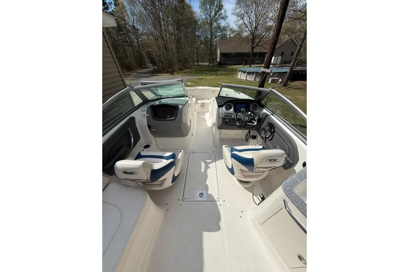 Slide: The Image of 2016 Chaparral 224 Sunesta boat interior with dual seating and steering console. - 18