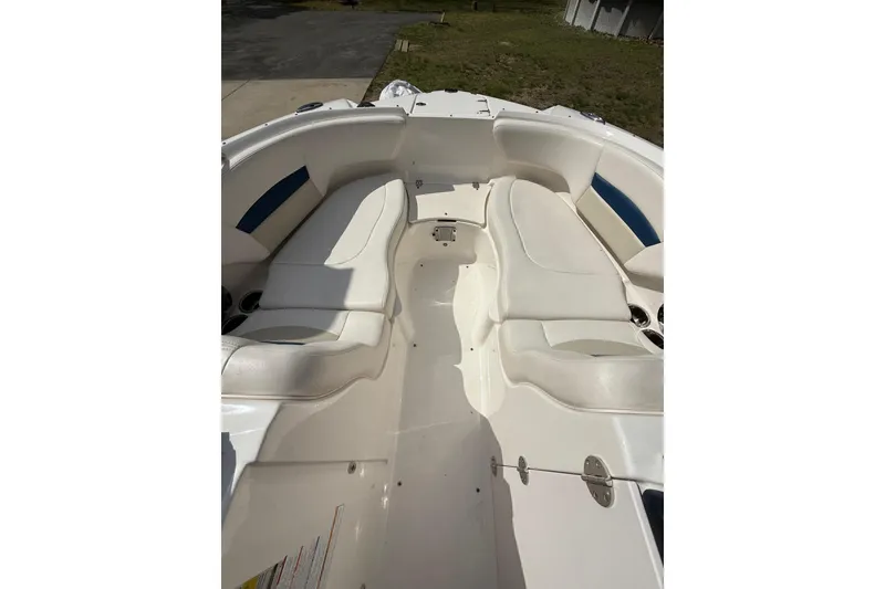 Slide: The Image of 2016 Chaparral 224 Sunesta boat interior with white seating and cup holders. - 26