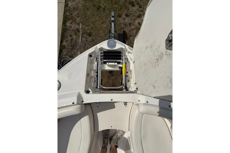 Slide: The Image of 2016 Chaparral 224 Sunesta boat bow with open anchor compartment and seating area. - 27