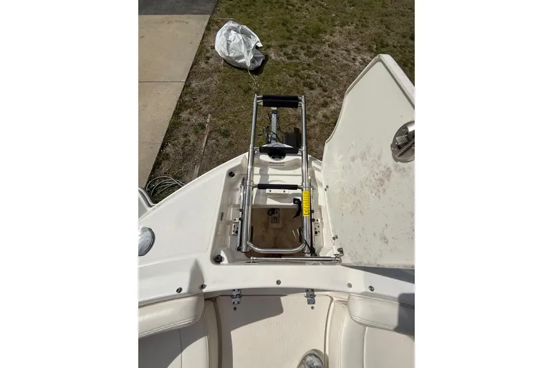 Slide: The Image of 2016 Chaparral 224 Sunesta boat with open storage compartment and ladder on deck. - 28