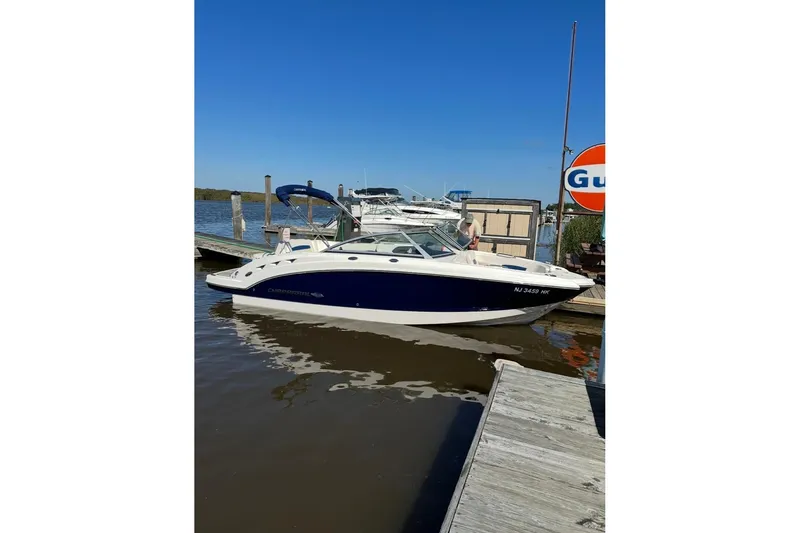 Slide: The Image of 2016 Chaparral 224 Sunesta boat docked at marina under clear blue sky. - 3