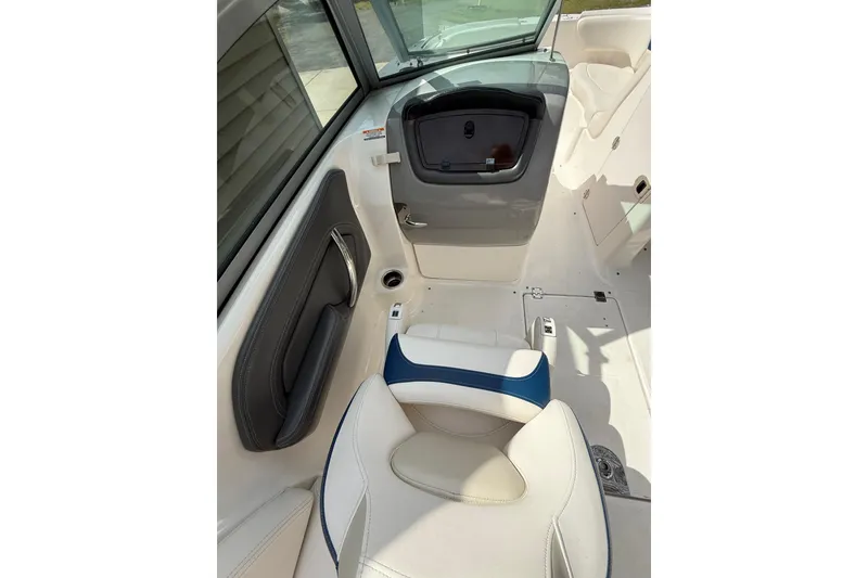 Slide: The Image of Interior of 2016 Chaparral 224 Sunesta boat, featuring white and blue seating. - 32