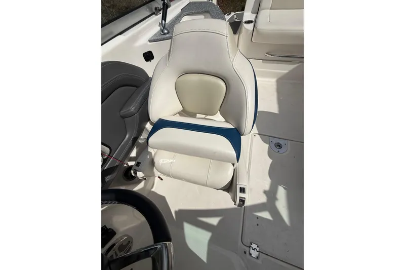 Slide: The Image of 2016 Chaparral 224 Sunesta boat seat, featuring white and blue upholstery. - 34