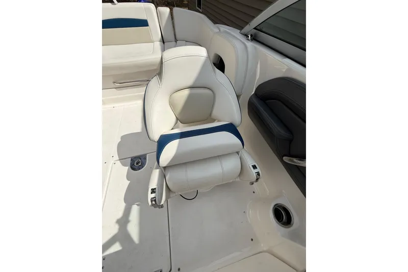 Slide: The Image of 2016 Chaparral 224 Sunesta boat interior with white and blue seating. - 35