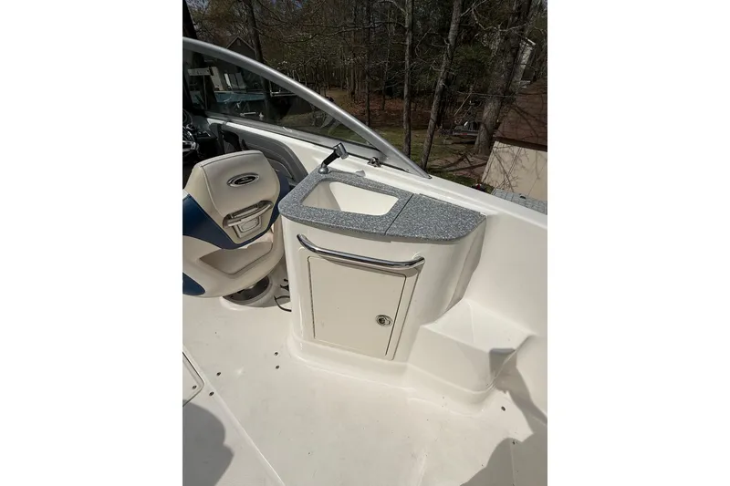 Slide: The Image of 2016 Chaparral 224 Sunesta boat interior with seating and sink area. - 43