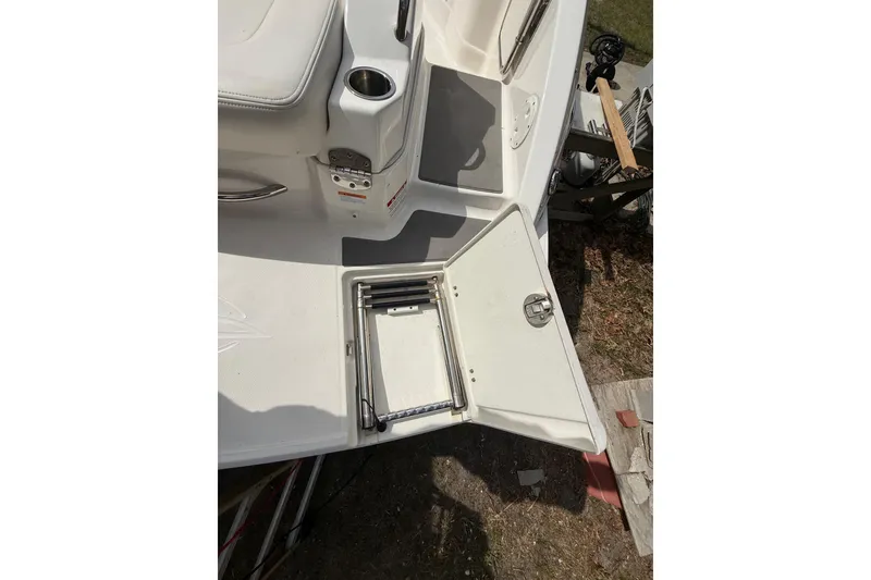 Slide: The Image of 2016 Chaparral 224 Sunesta boat with open swim platform ladder. - 53