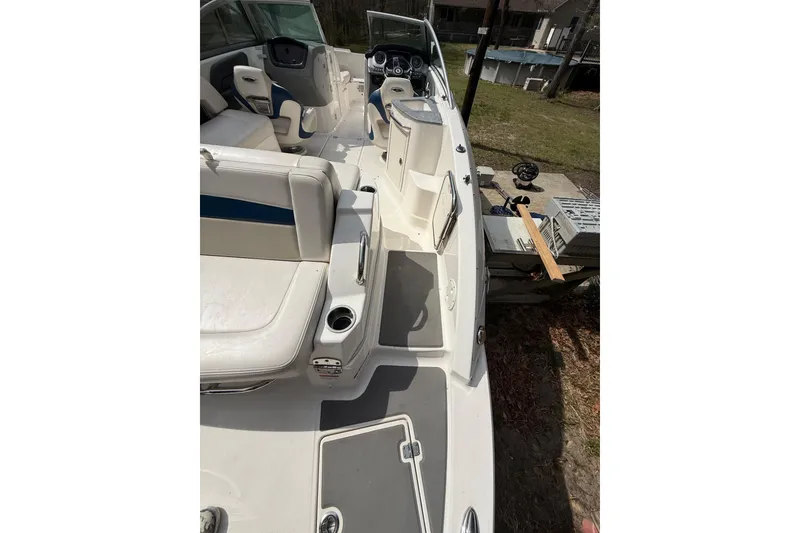 Slide: The Image of 2016 Chaparral 224 Sunesta boat interior with white seating and dashboard view. - 54