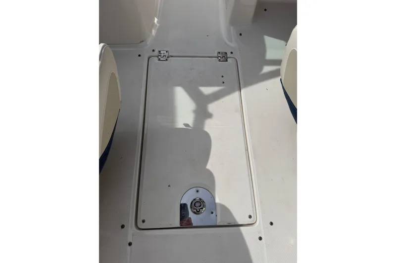 Slide: The Image of 2016 Chaparral 224 Sunesta boat deck with storage compartment and latch. - 55
