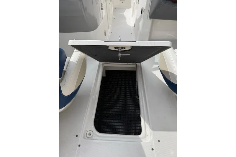 Slide: The Image of Open storage compartment on 2016 Chaparral 224 Sunesta boat deck. - 56