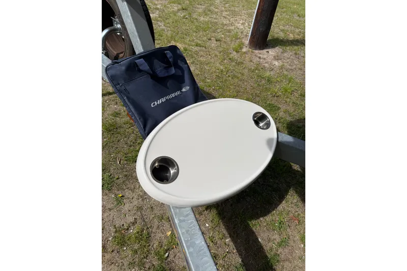 Slide: The Image of 2016 Chaparral 224 Sunesta boat accessory with cup holders on grass. - 62