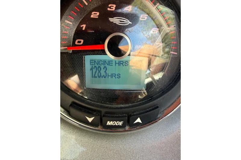 Slide: The Image of Close-up of 2016 Chaparral 224 Sunesta tachometer showing 128.3 engine hours. - 65