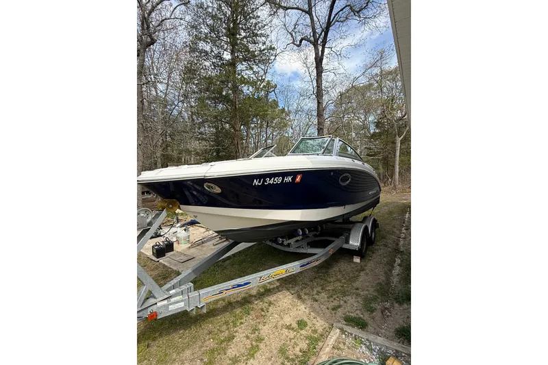 Slide: The Image of 2016 Chaparral 224 Sunesta boat on trailer, parked outdoors. - 8