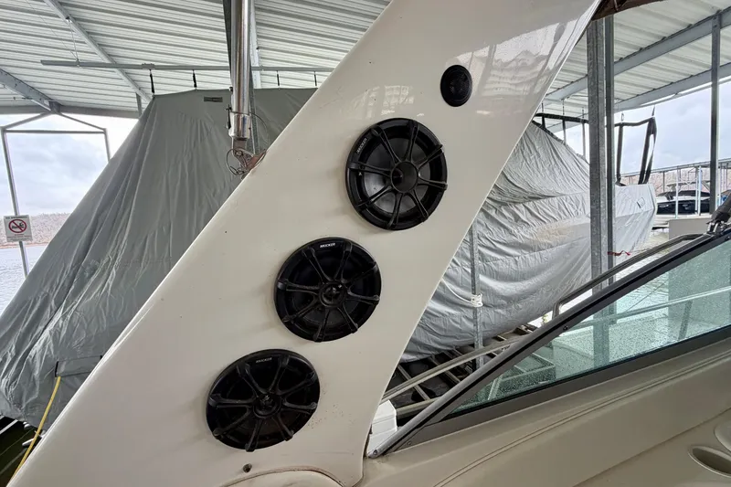 Slide: The Image of Speakers on a 2001 Sea Ray 340 Sundancer boat under a covered dock. - 10