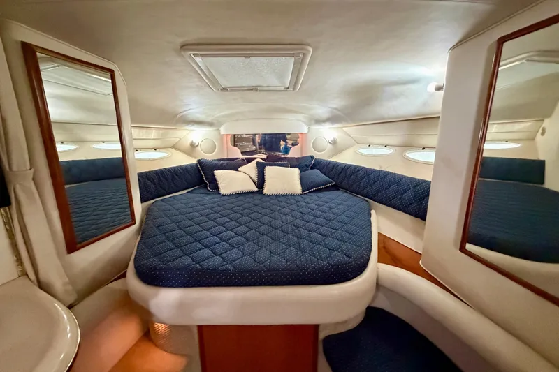 Slide: The Image of Luxurious cabin interior of 2001 Sea Ray 340 Sundancer yacht with cozy bedding. - 17