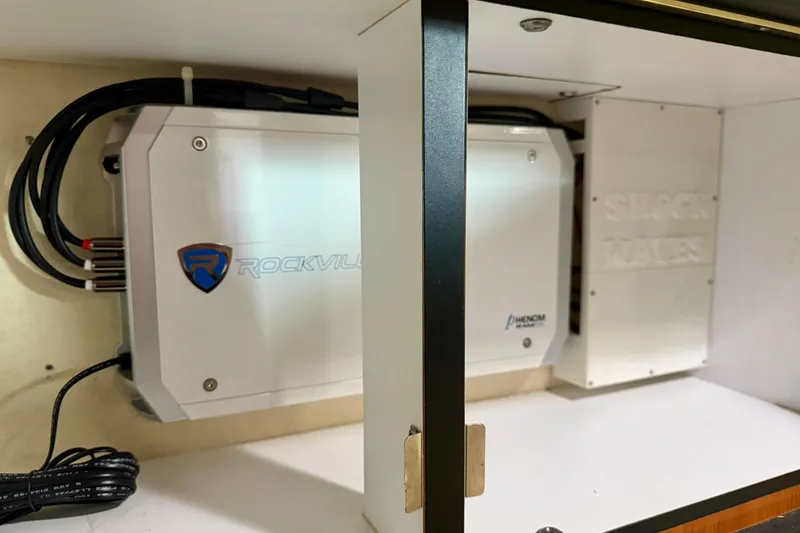 Slide: The Image of Rockville audio equipment installed in a 2001 Sea Ray 340 Sundancer boat cabinet. - 26