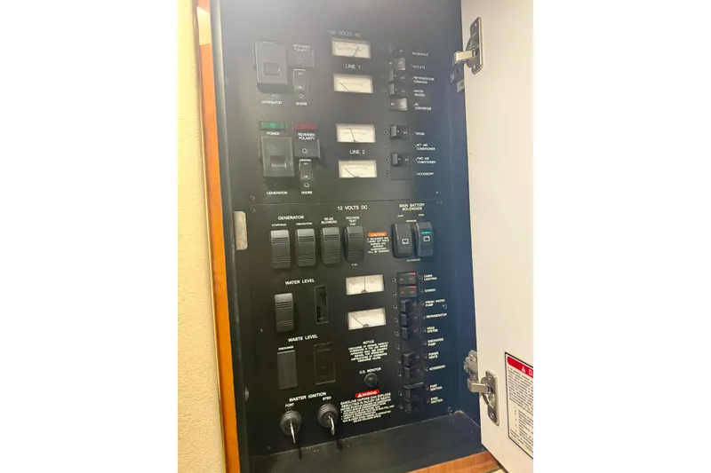 Slide: The Image of Electrical control panel on a 2001 Sea Ray 340 Sundancer boat. - 27
