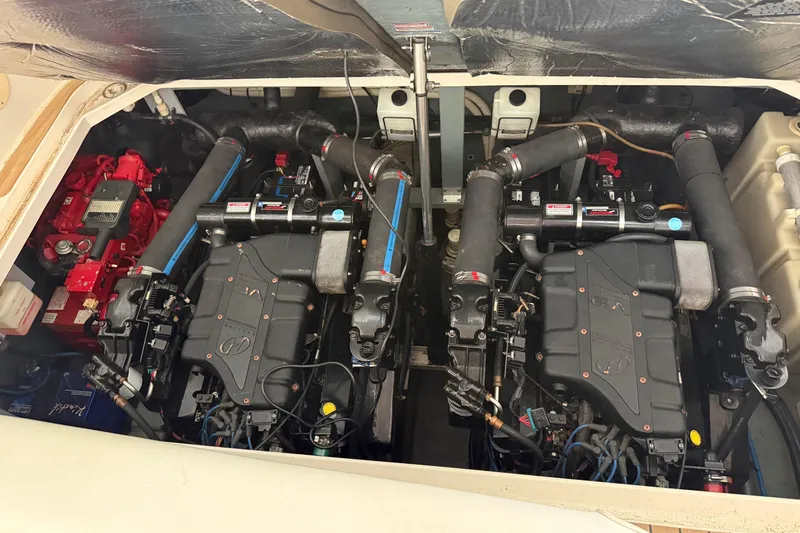 Slide: The Image of Engine compartment of a 2001 Sea Ray 340 Sundancer, showcasing dual engines and components. - 28